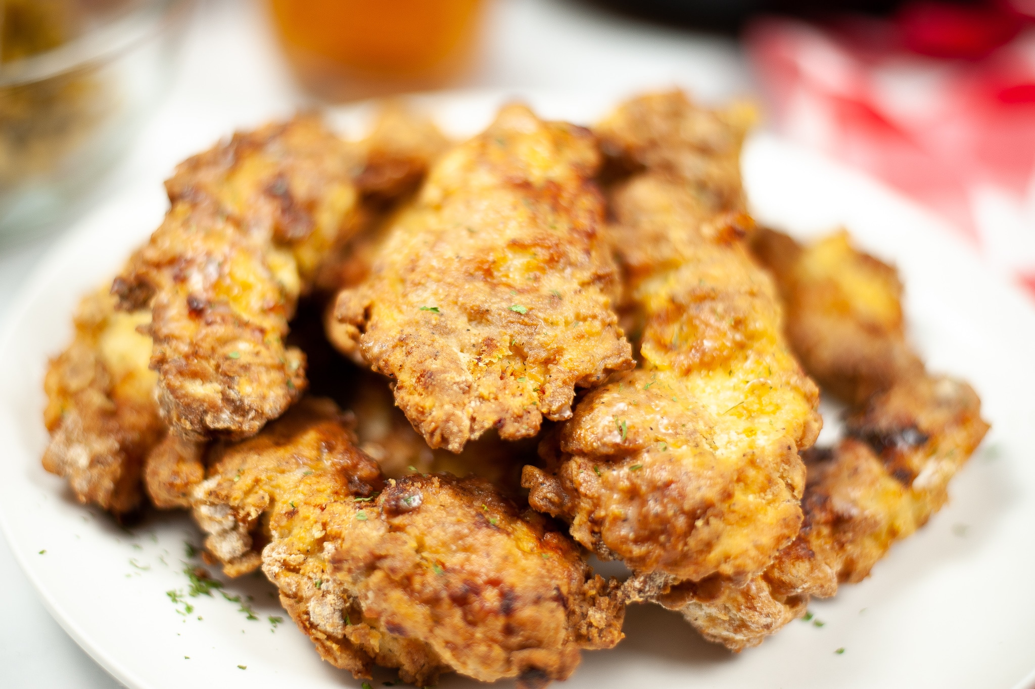 a closeup of Air Fryer Chicken Tenders on a white plate