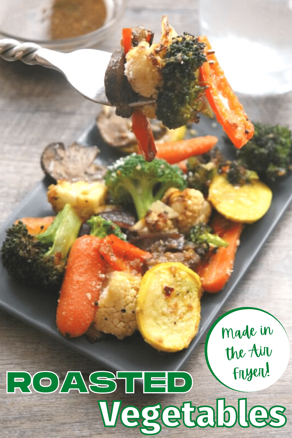 Air Fryer Roasted Vegetables on a plate with a portion of it in a fork