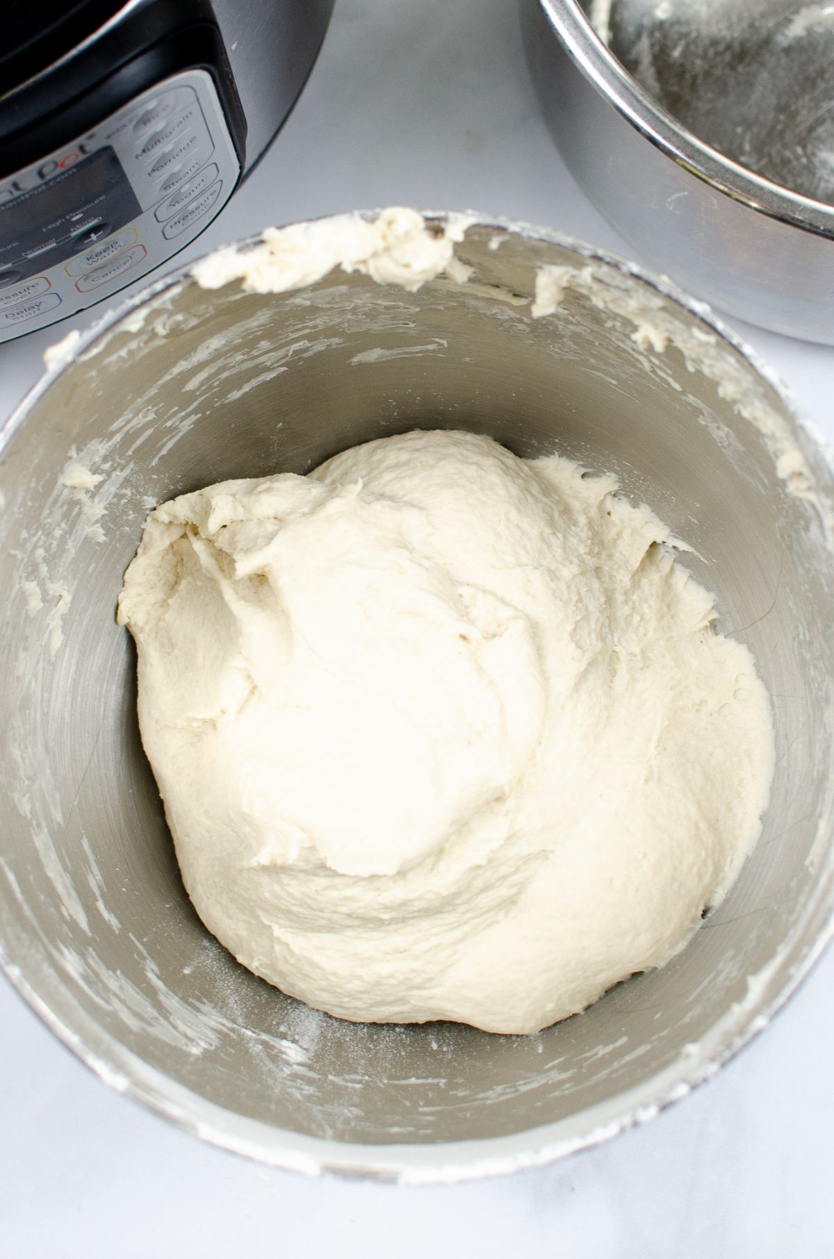 Dough in a mixing bowl.