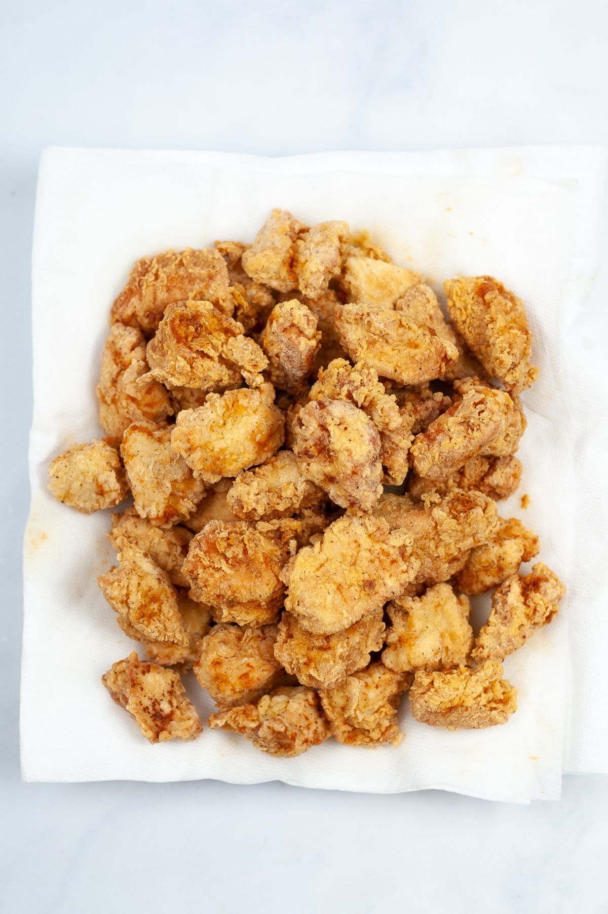 fried chicken pieces on a paper towel