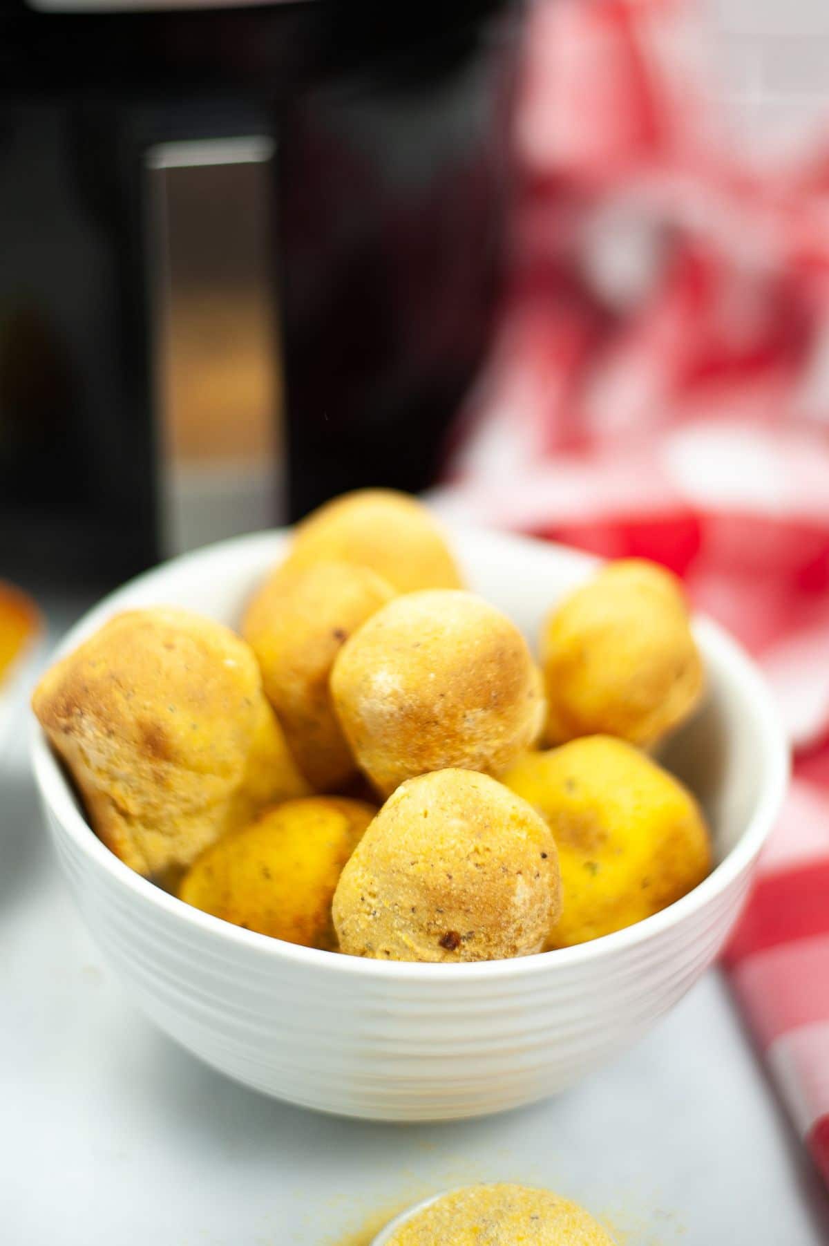 Air Fryer Hush Puppies in a white bowl