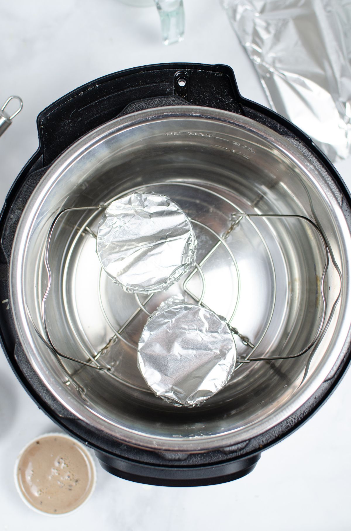 2 ramekins covered with foil and placed in the instant pot for steaming.