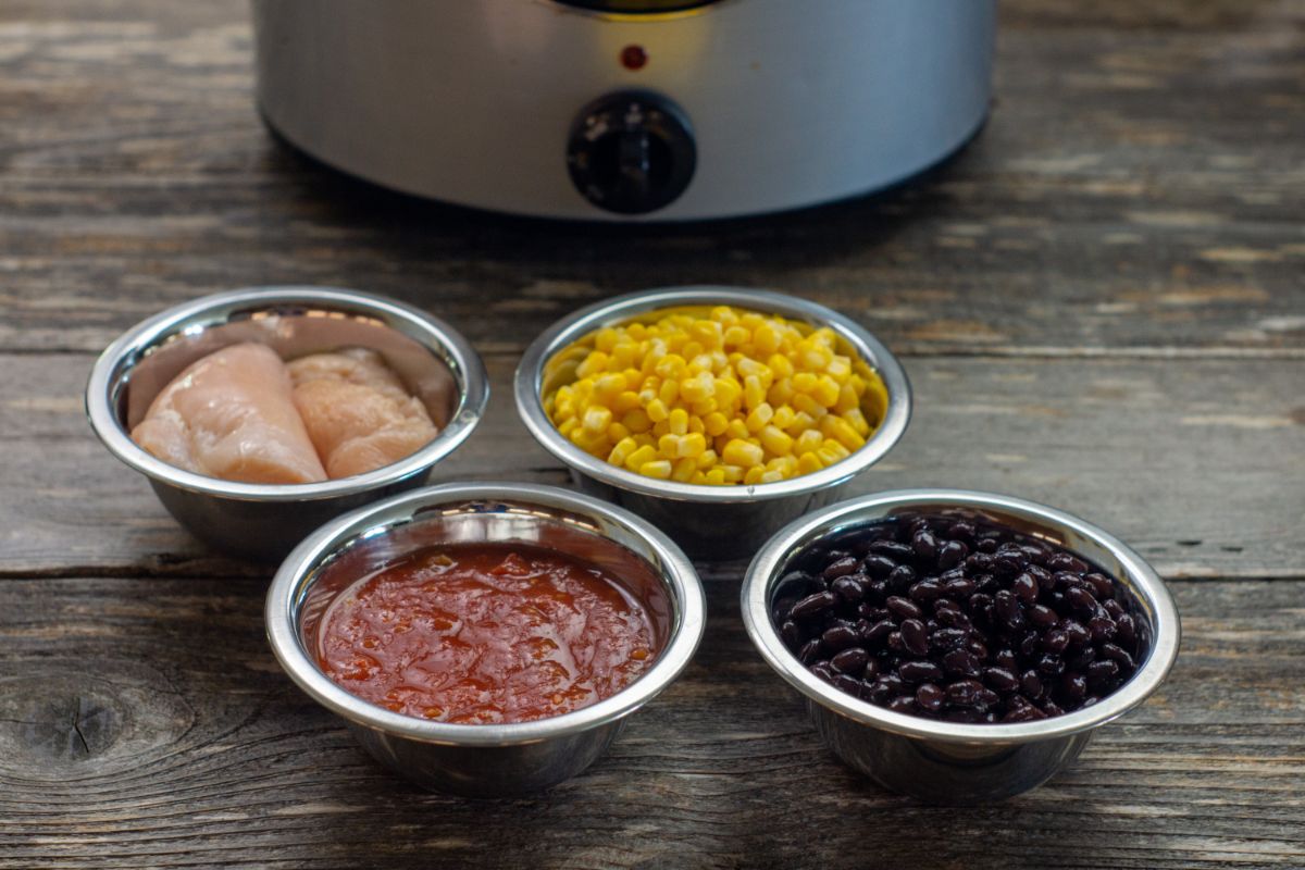 Ingredients used to make Salsa Chicken: chicken breasts, salsa, black beans, and corn.