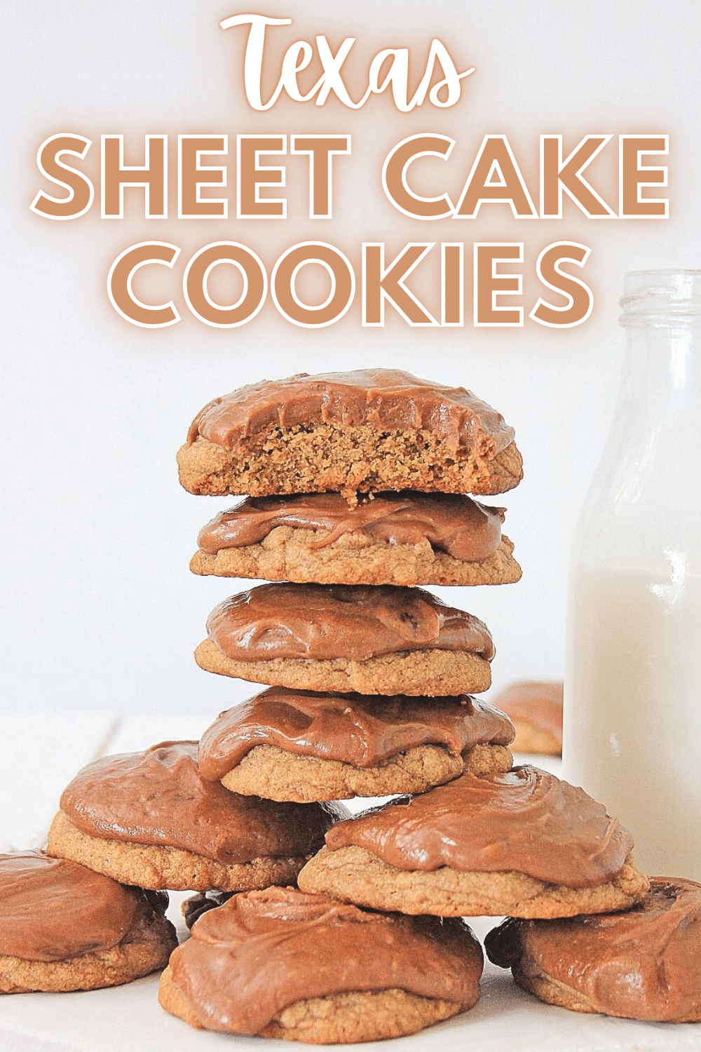 An image of stacked Texas Sheet Cookies, with the top cookie cut into half highlighting the cross section of the cookie with a text at the top saying "Texas Sheet Cake Cookies".