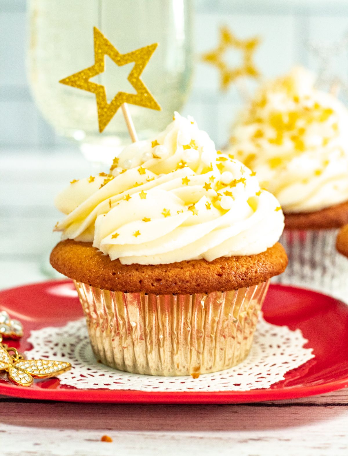 Champagne Cupcakes decorated with gold stars.