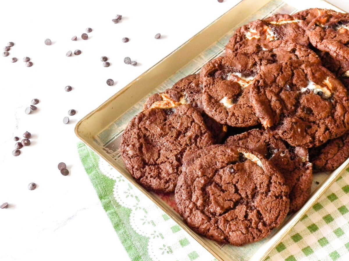 Christmas Hot Cocoa Cookies on a baking tray, positioned at the right side of the photo.