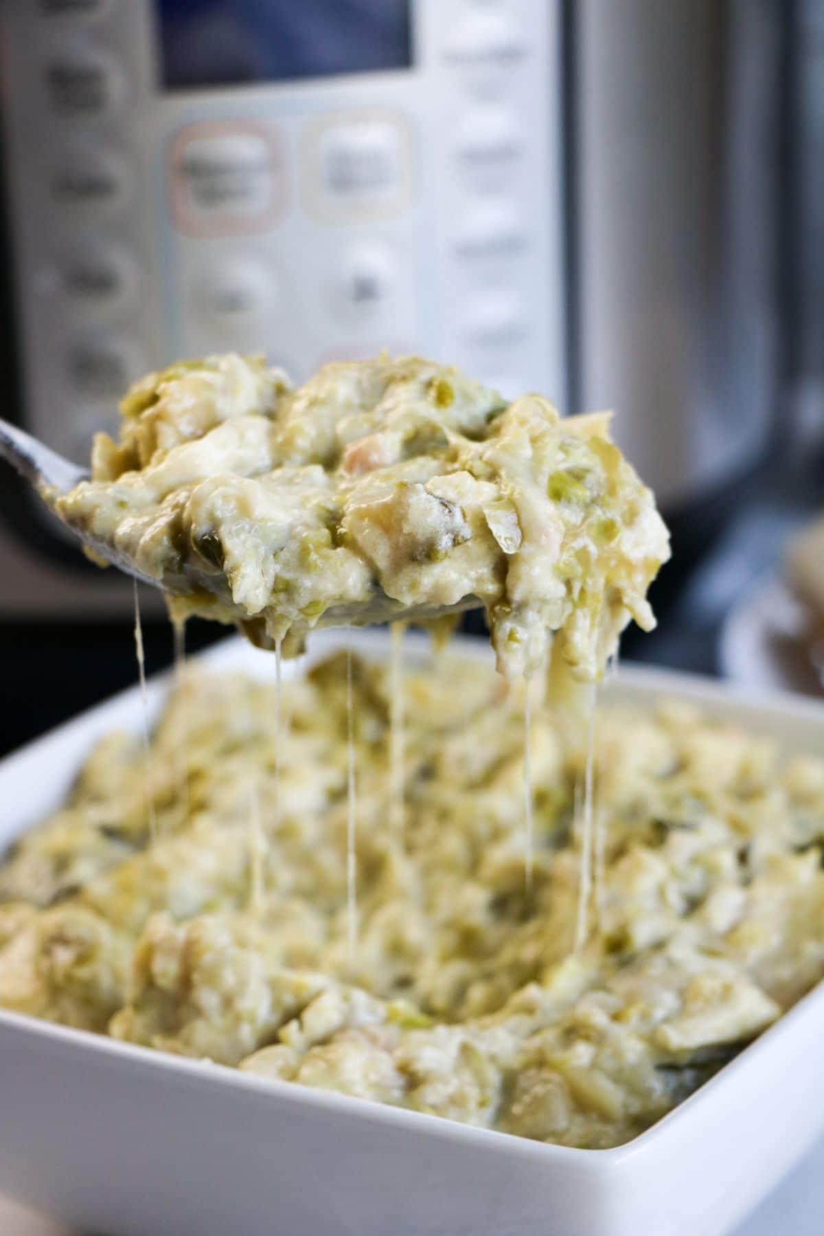 A close up of a spoonful of Instant Pot Creamed Brussel Sprouts.