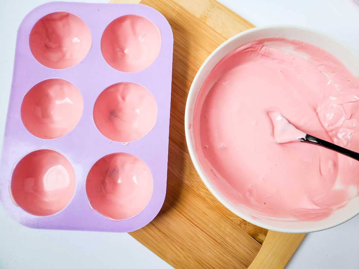 molds coated with melted strawberry