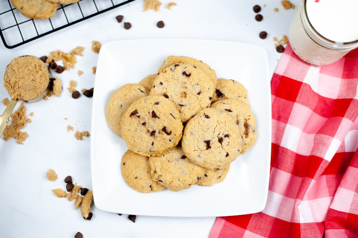 A horizontal overhead shot of Air Fryer Chocolate Chip Cookies on a white serving plate.