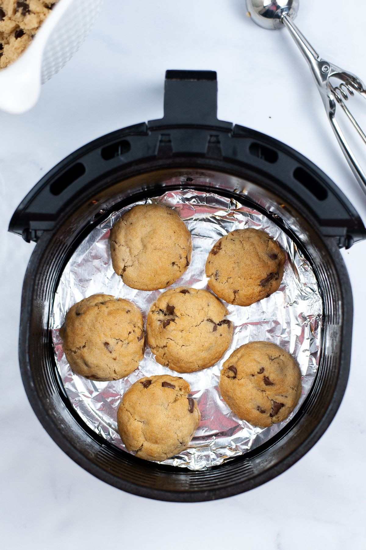 cookies in an air fryer basket.