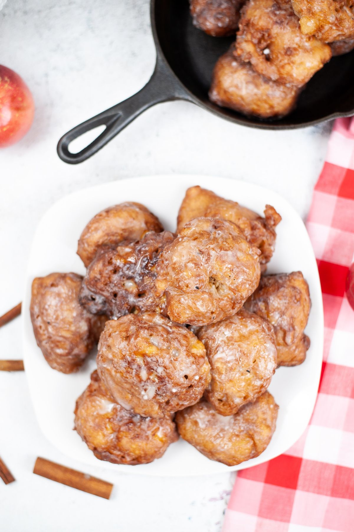 Apple Fritters on a white serving plate.