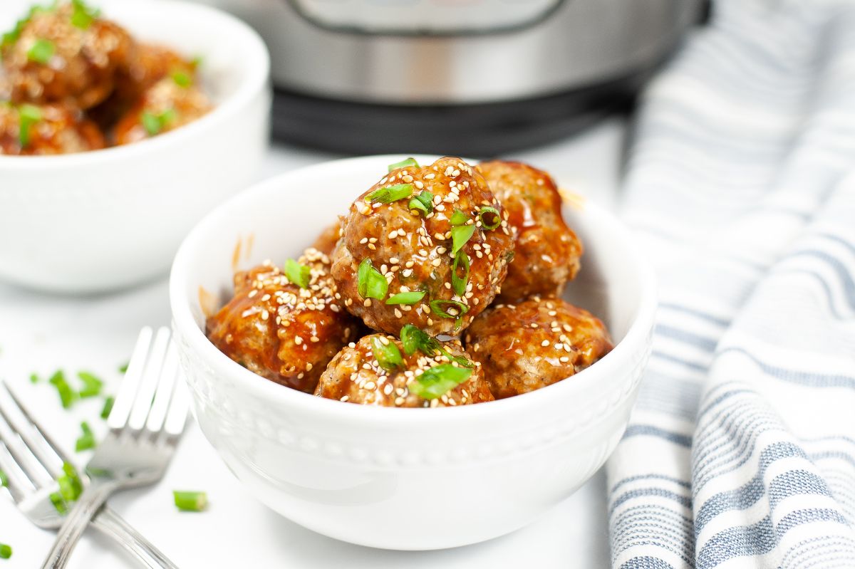 Instant Pot Asian Meatballs in a white serving bowl.