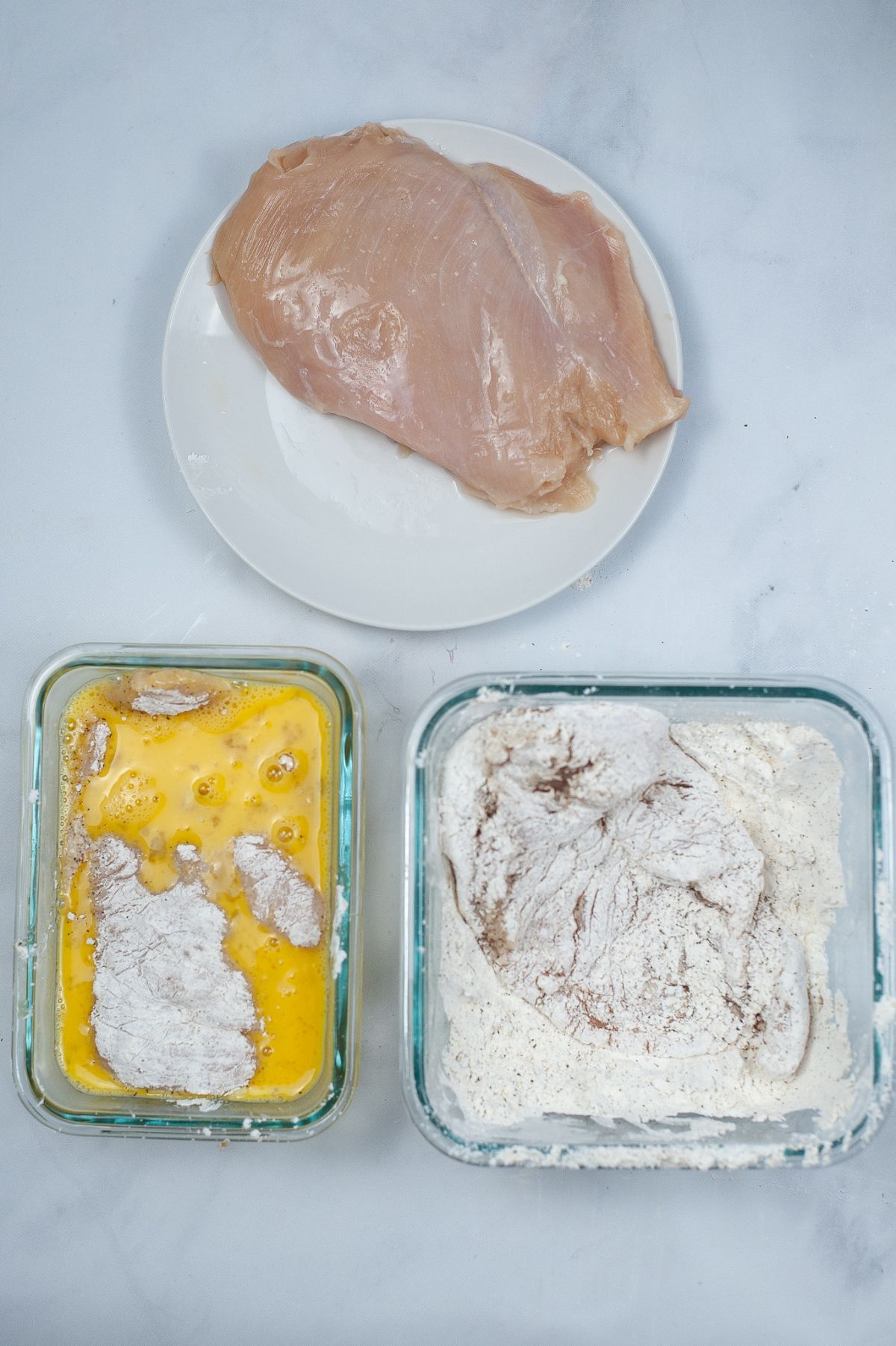 An image showing the three-step process before cooking the Air Fryer Chicken Parmesan.