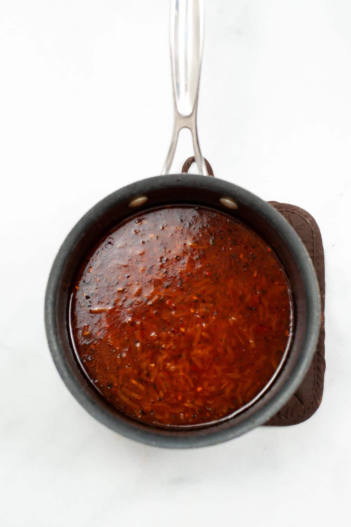 Sauce being cooked in a saucepan.
