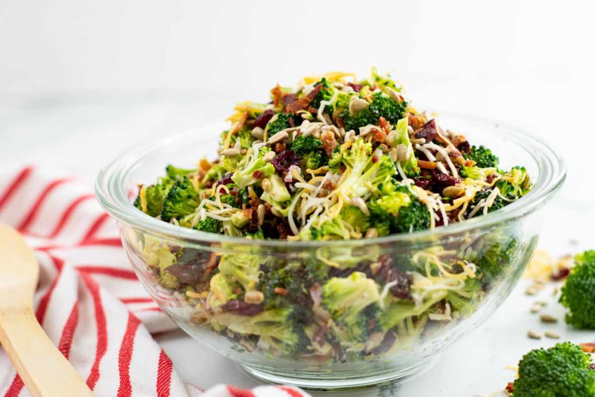 Horizontal shot of Broccoli Bacon and Cheese Salad in a glass bowl.