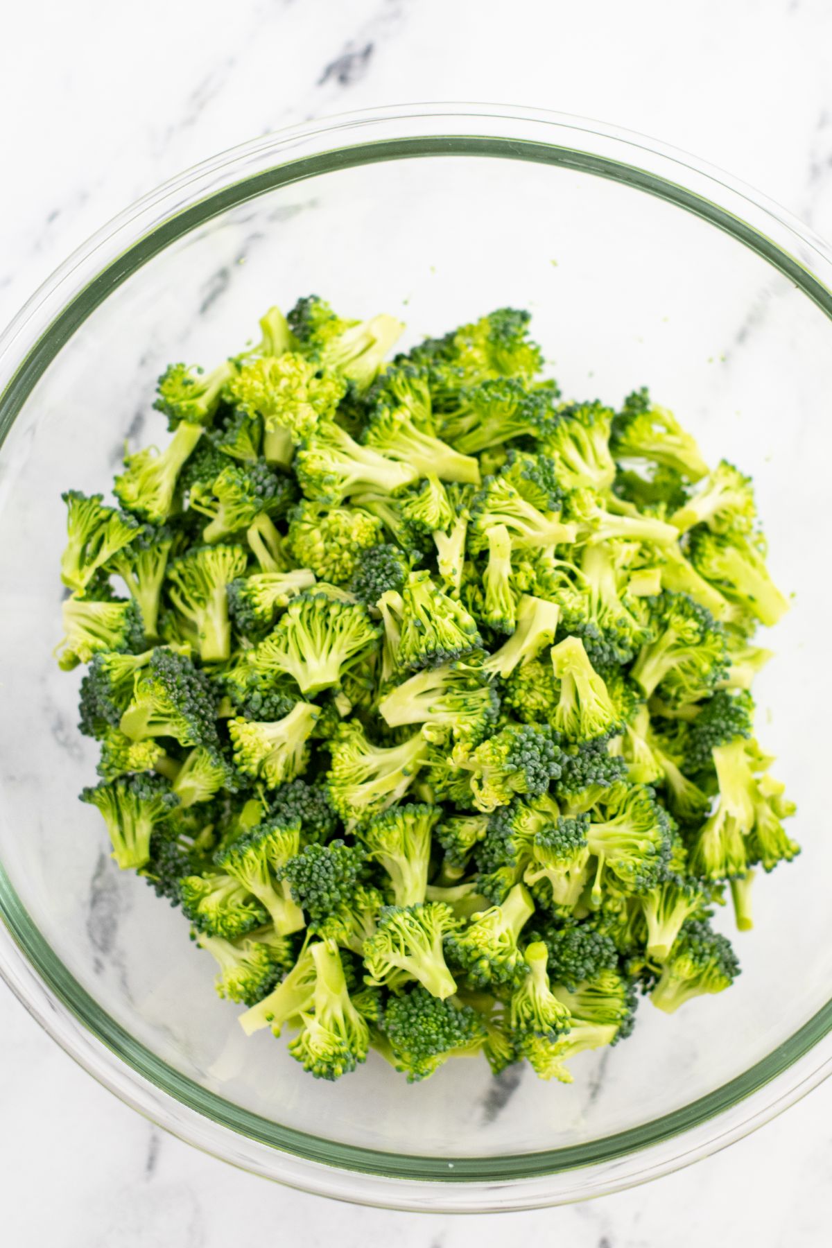 Chopped Broccoli in a glass bowl.