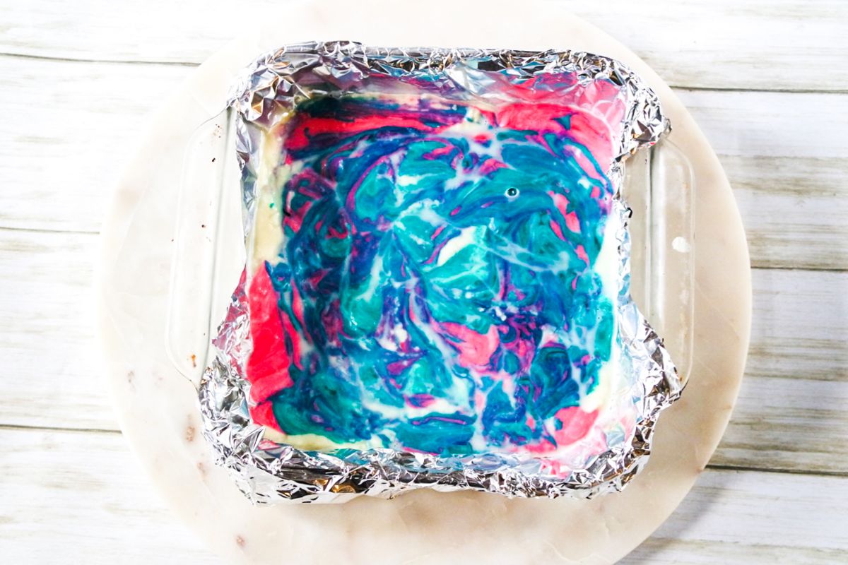 Chilled Cotton Candy Fudge. in a pan on a plate