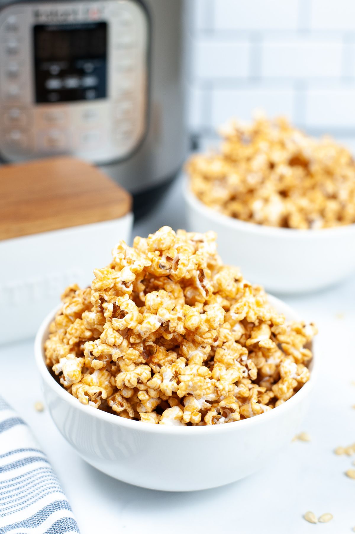 Instant Pot Caramel Popcorn in a white bowl