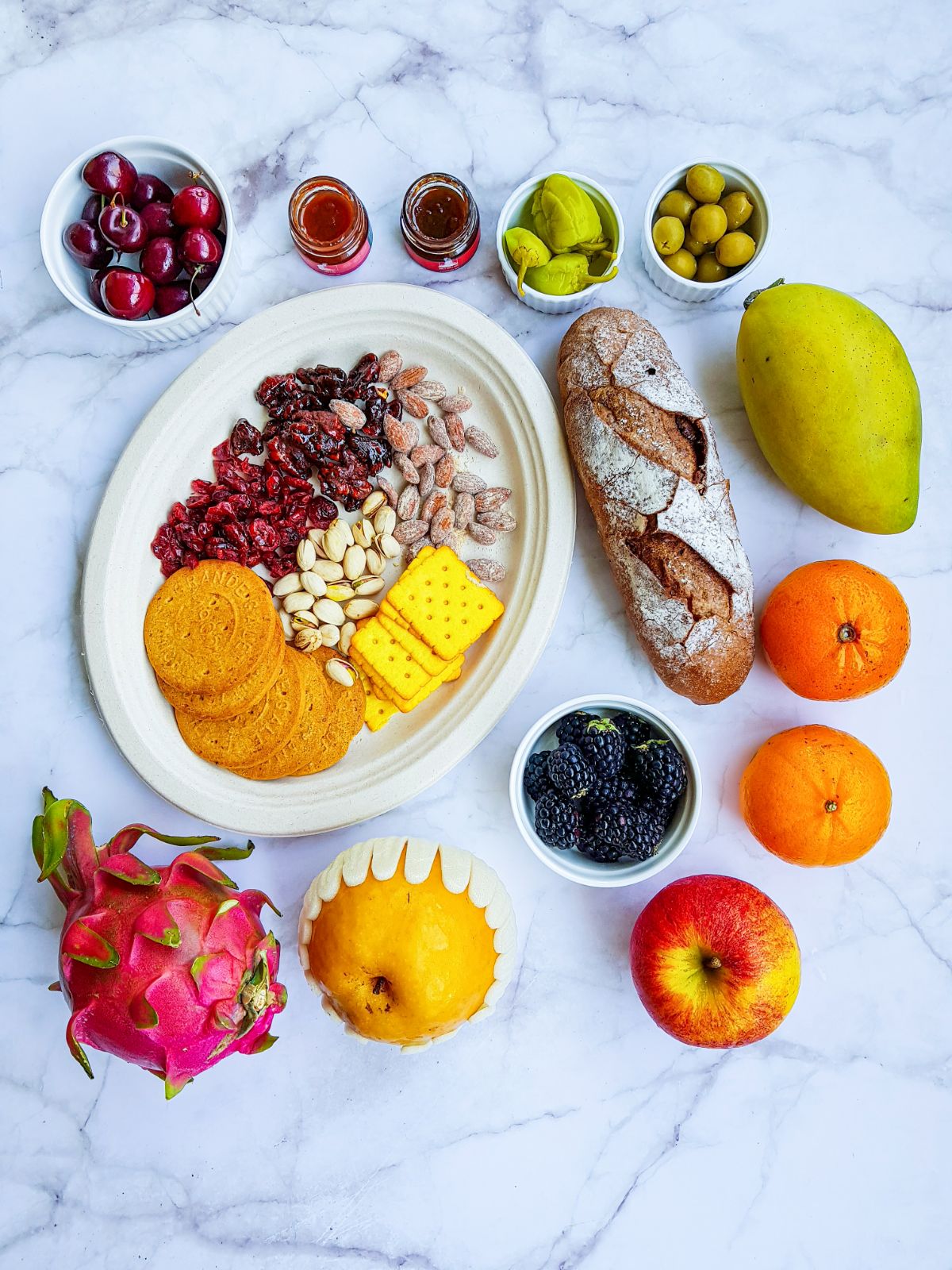Fresh fruits, Nuts, Dried fruits, and Pickles for Simple Charcuterie Board.
