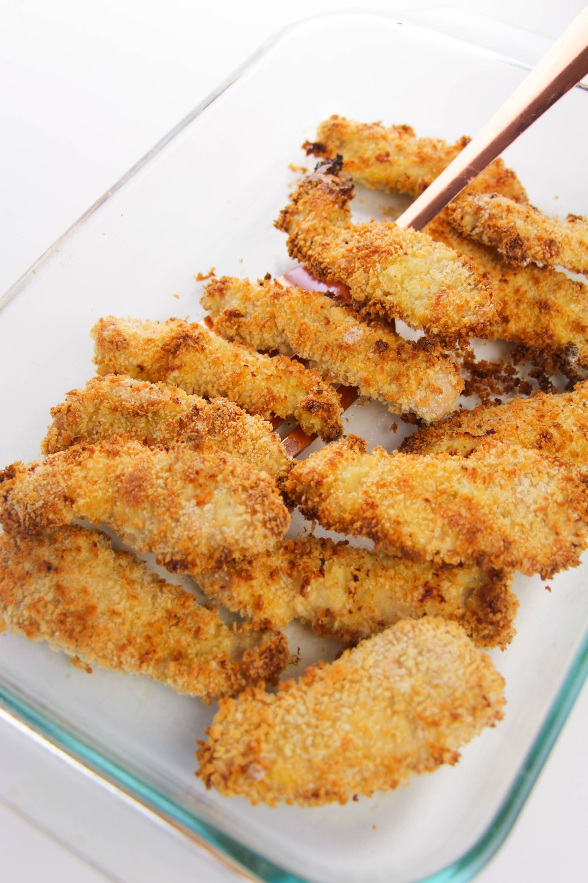 baked chicken tenders in a glass baking dish