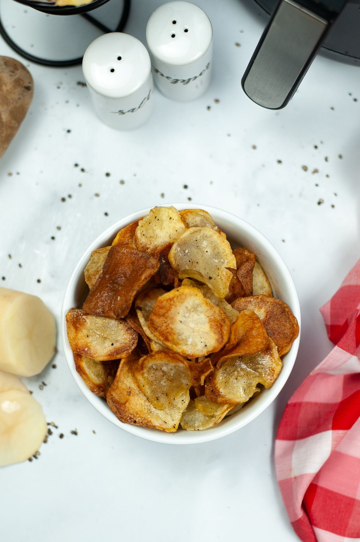 overhead shot of Homemade Air Fryer Potato Chips in white bowl 