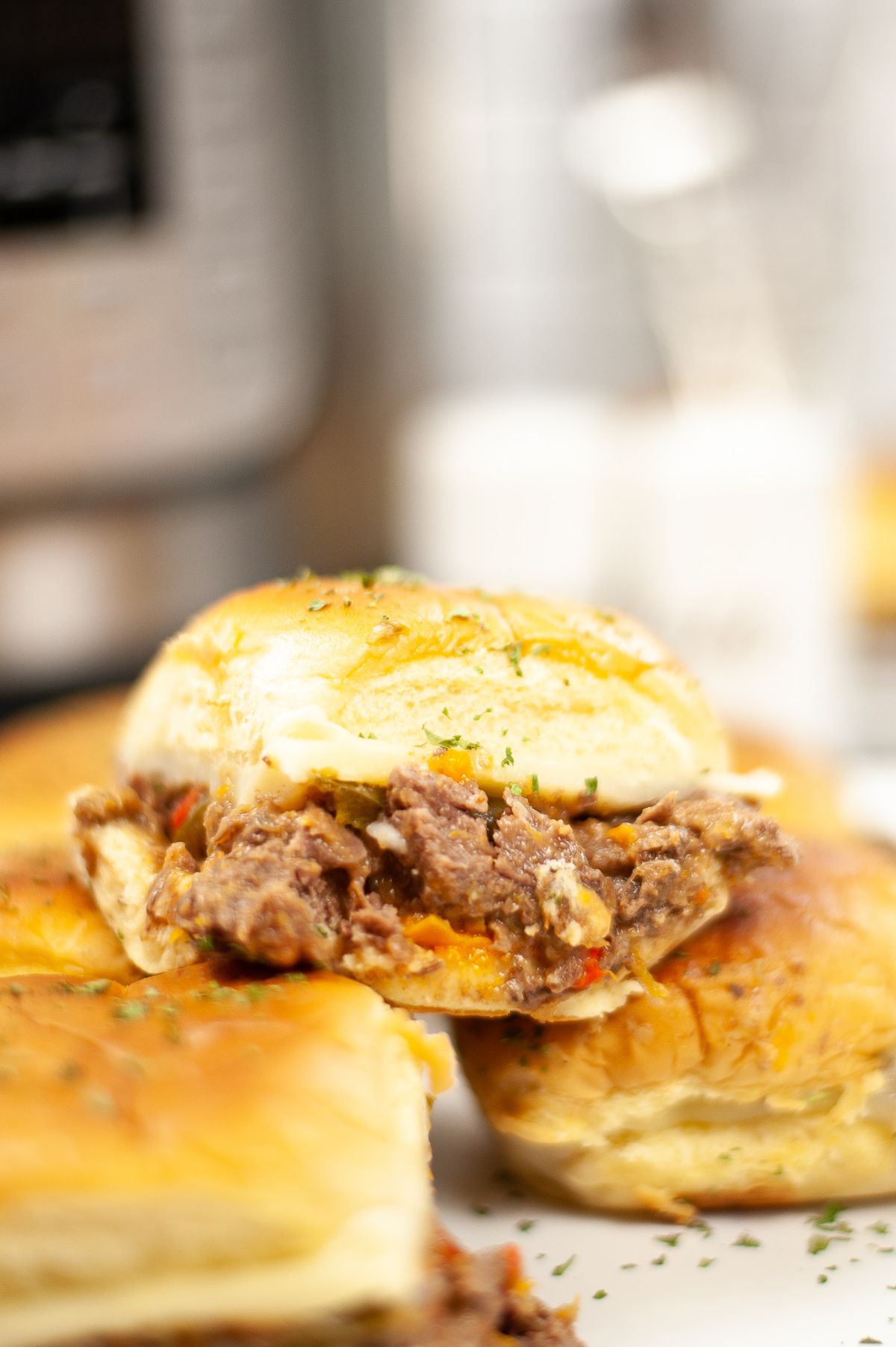 a closeup of Instant Pot Philly Cheesesteak Sliders