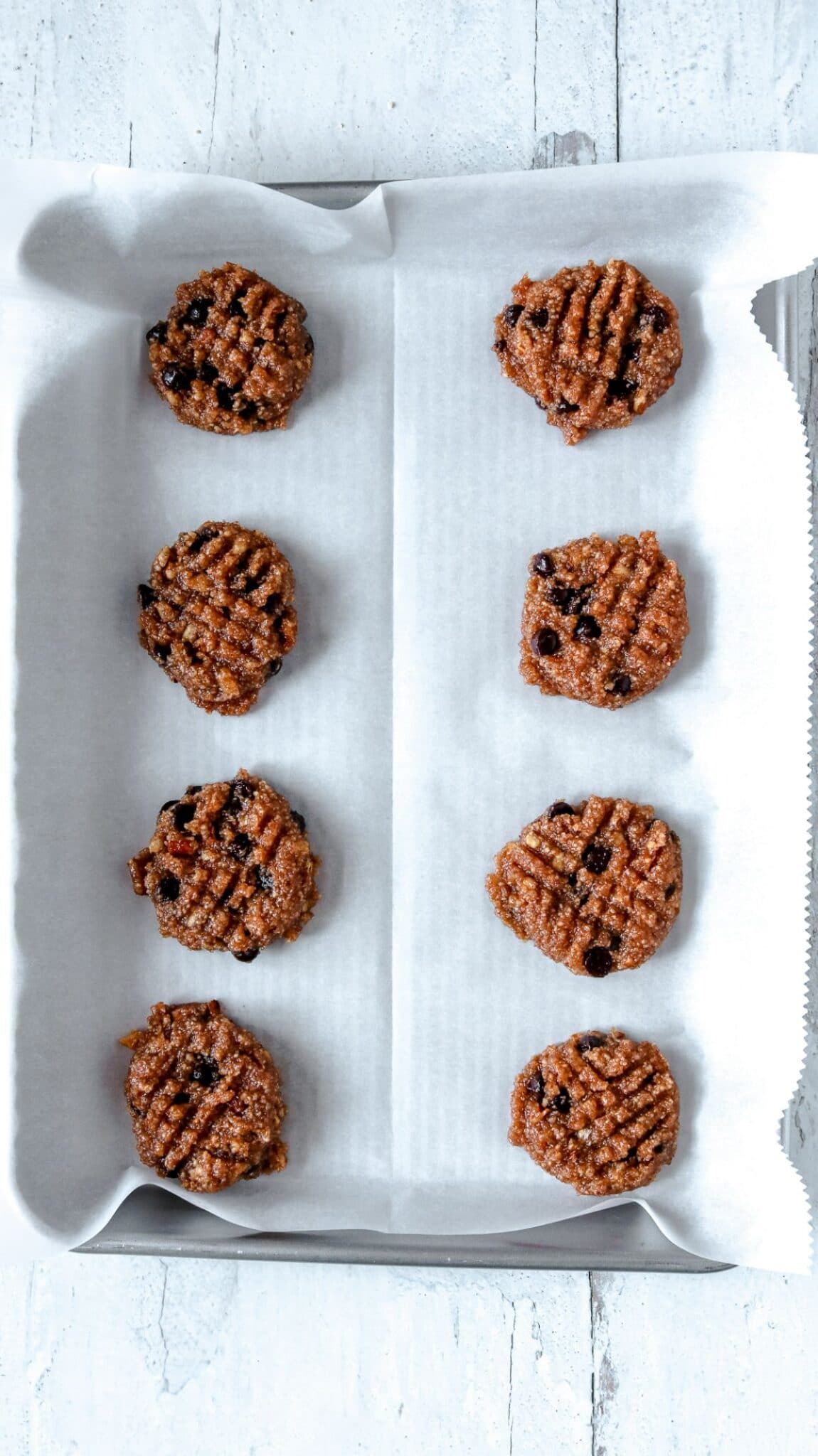 cookies on parchment paper on a sheet pan 