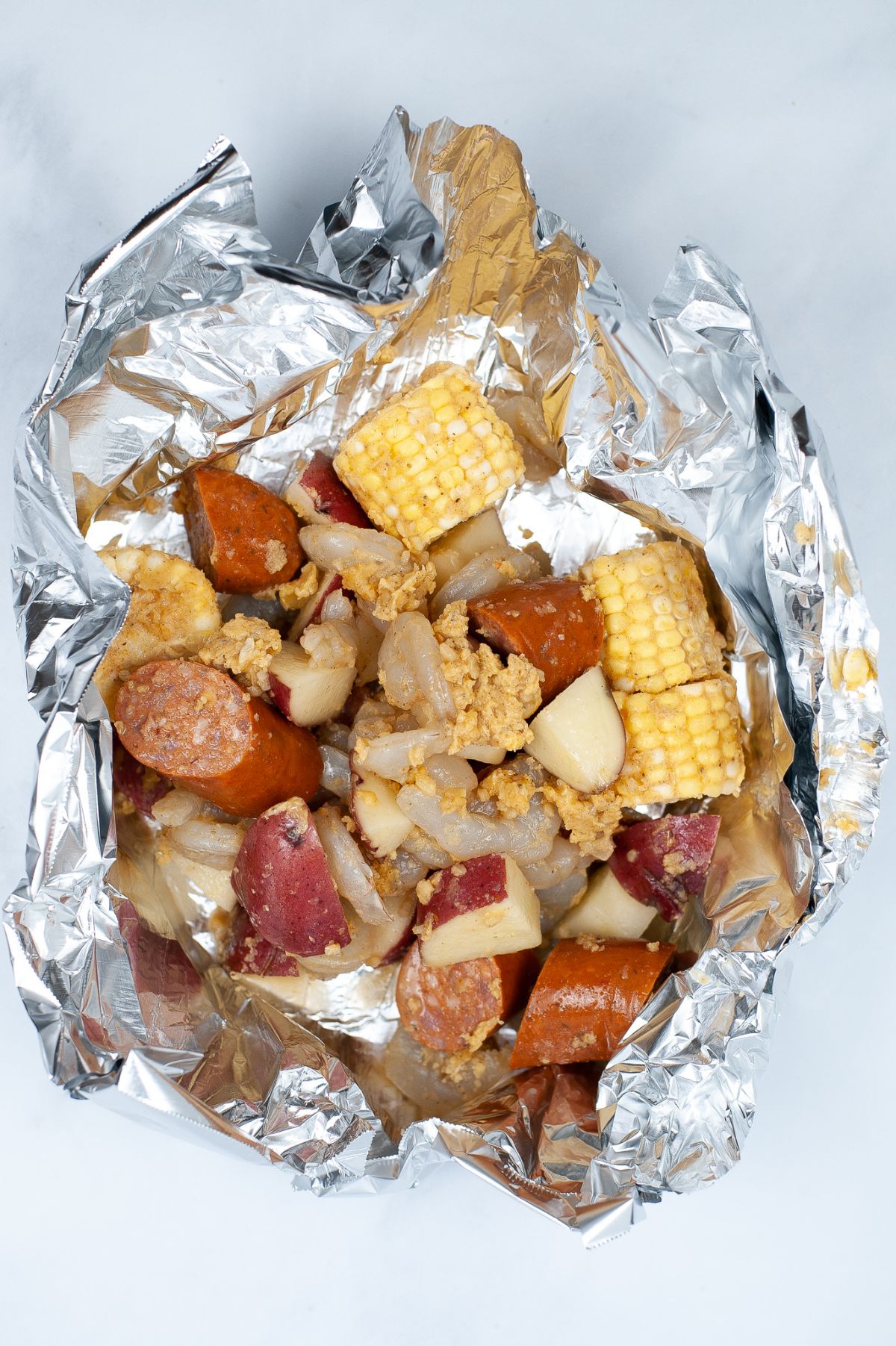 ingredients in foil for making Low Country Boil Foil Packets