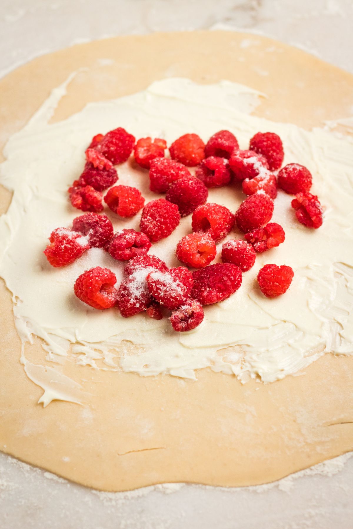 Pie dough with cream cheese and raspberries