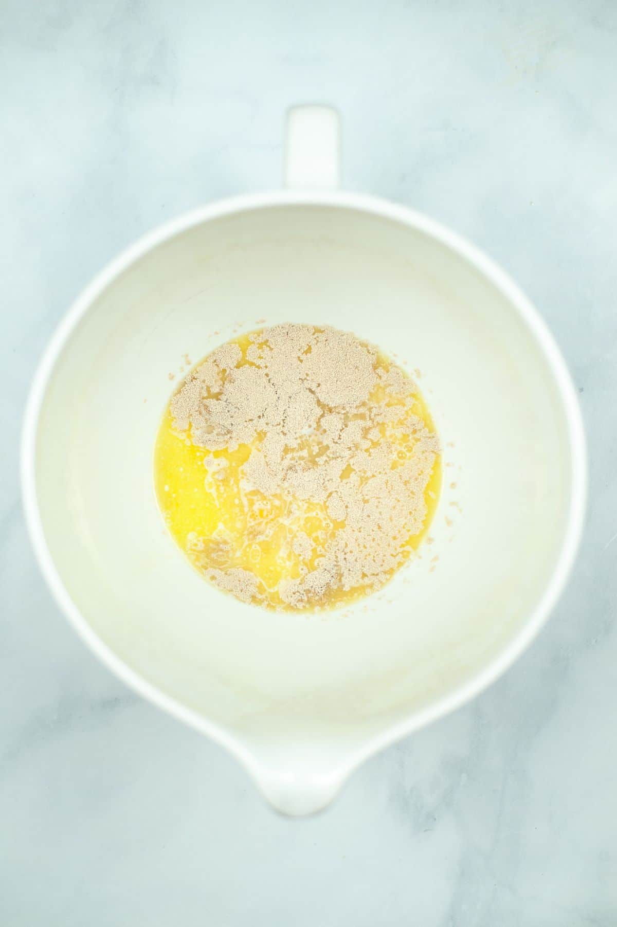 melted butter and sugar in a white bowl