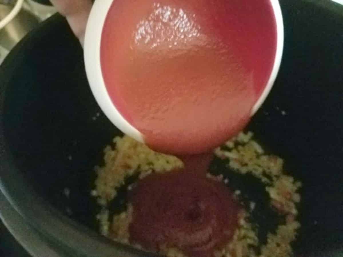 tomato puree and taco seasoning being added to the instant pot