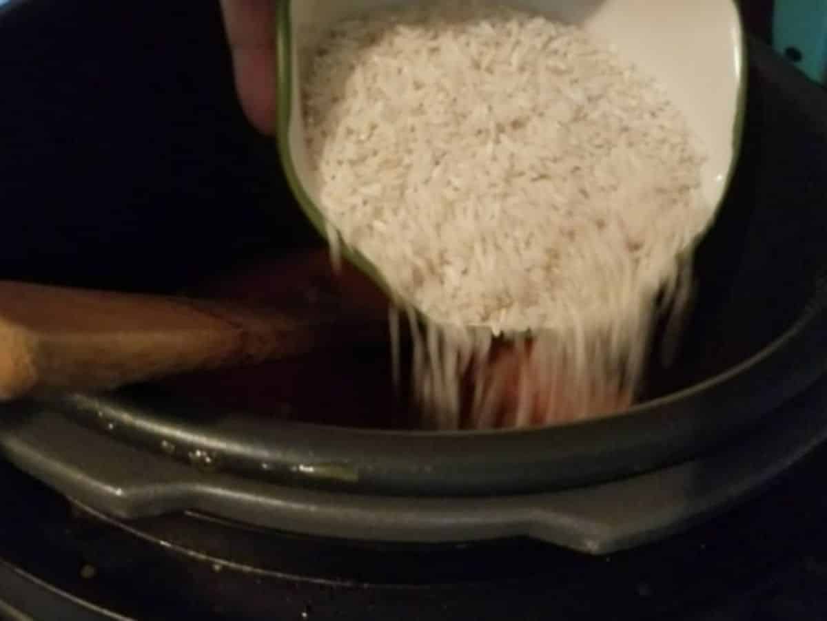 rice being added to the instant pot