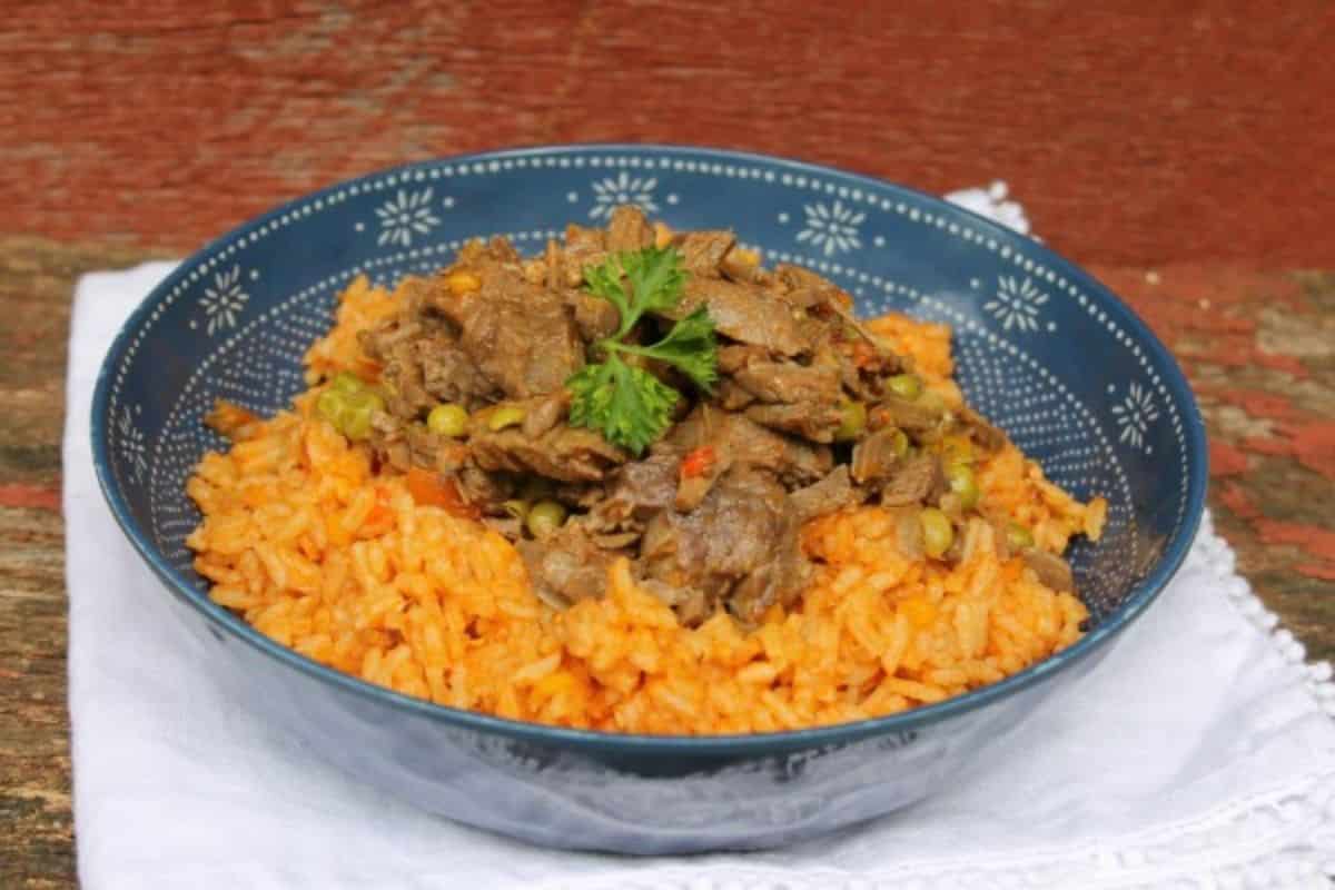Instant Pot Ropa Vieja in a bowl on a white cloth