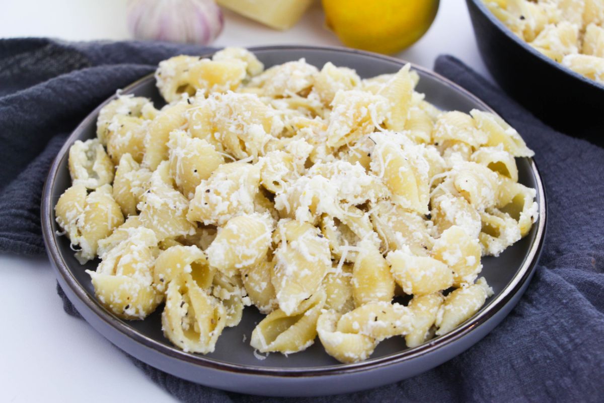 Lemon Ricotta Pasta on a plate topped with grated  parmesan cheese