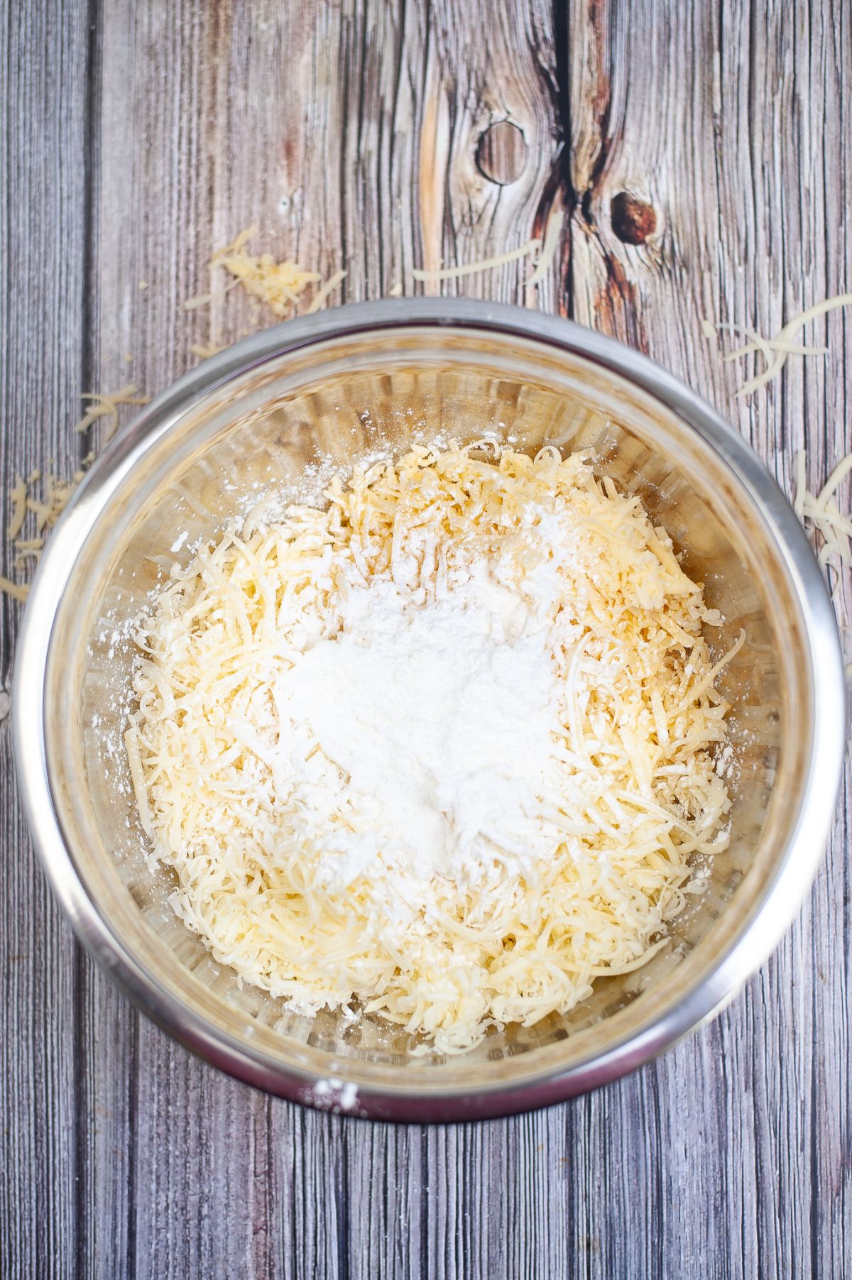 Cheese and cornstarch in a bowl