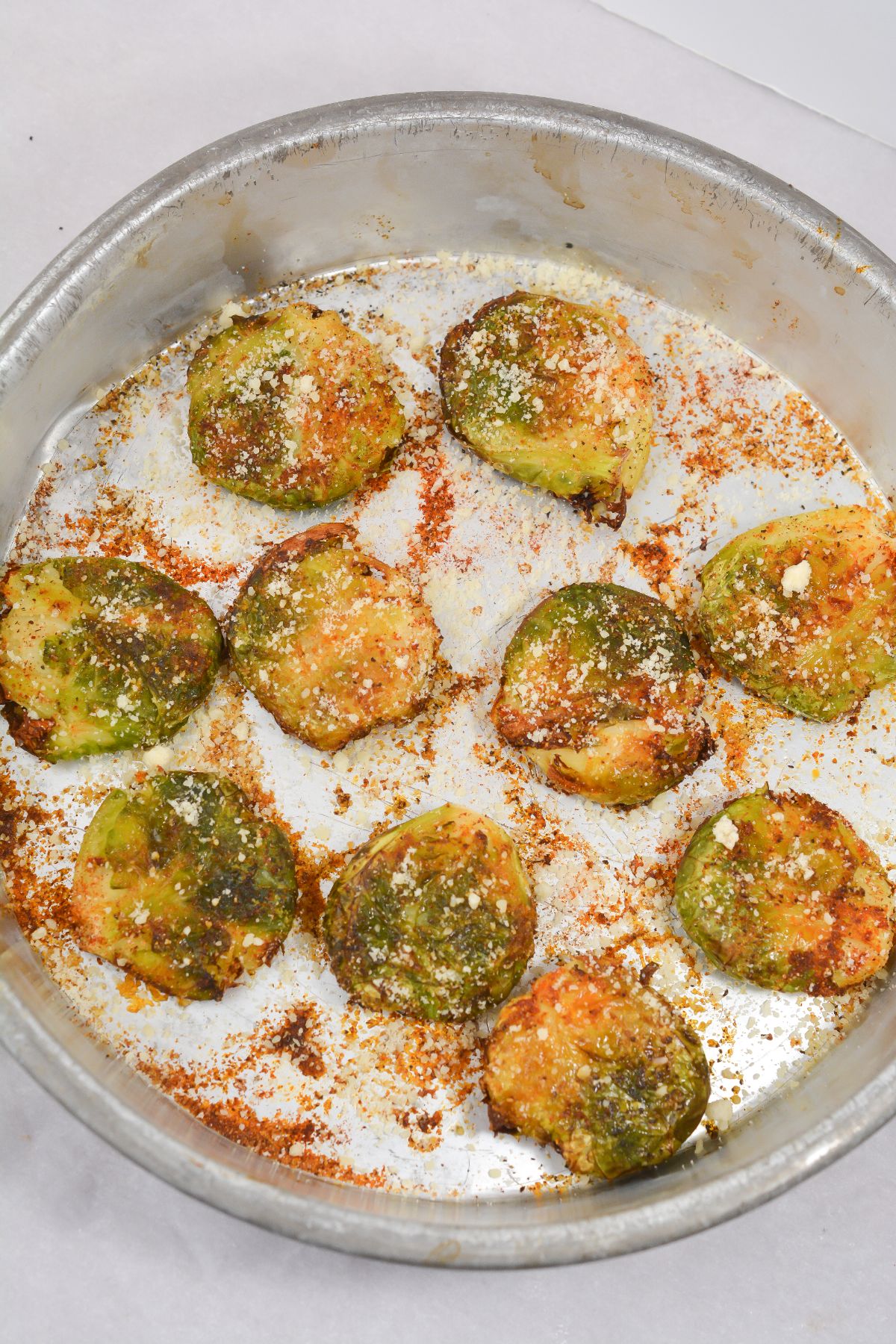 Air Fryer Keto Brussel Sprouts in a pan with parmesan cheese on top