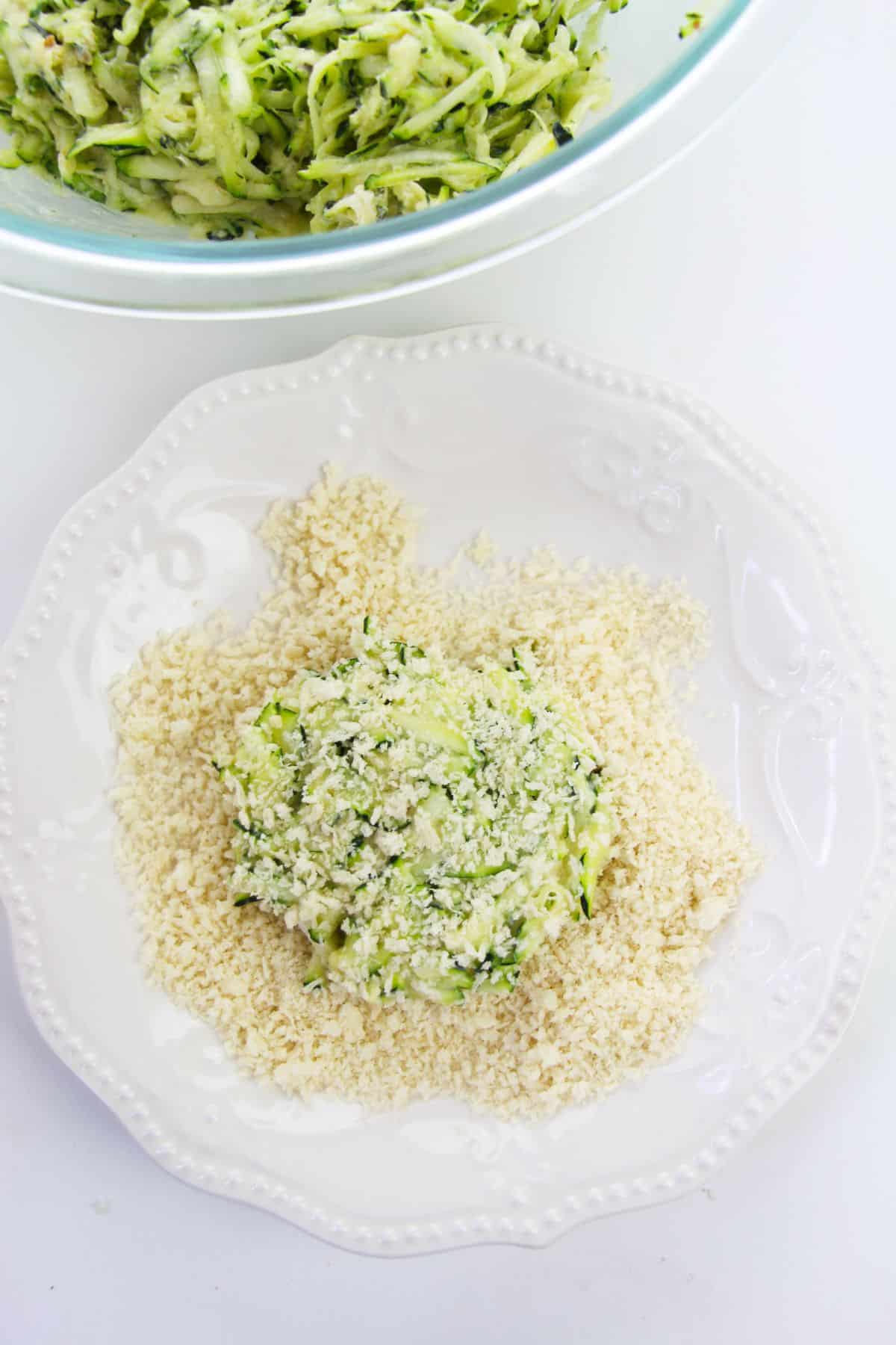 zucchini mixture in breadcrumbs on a white plate