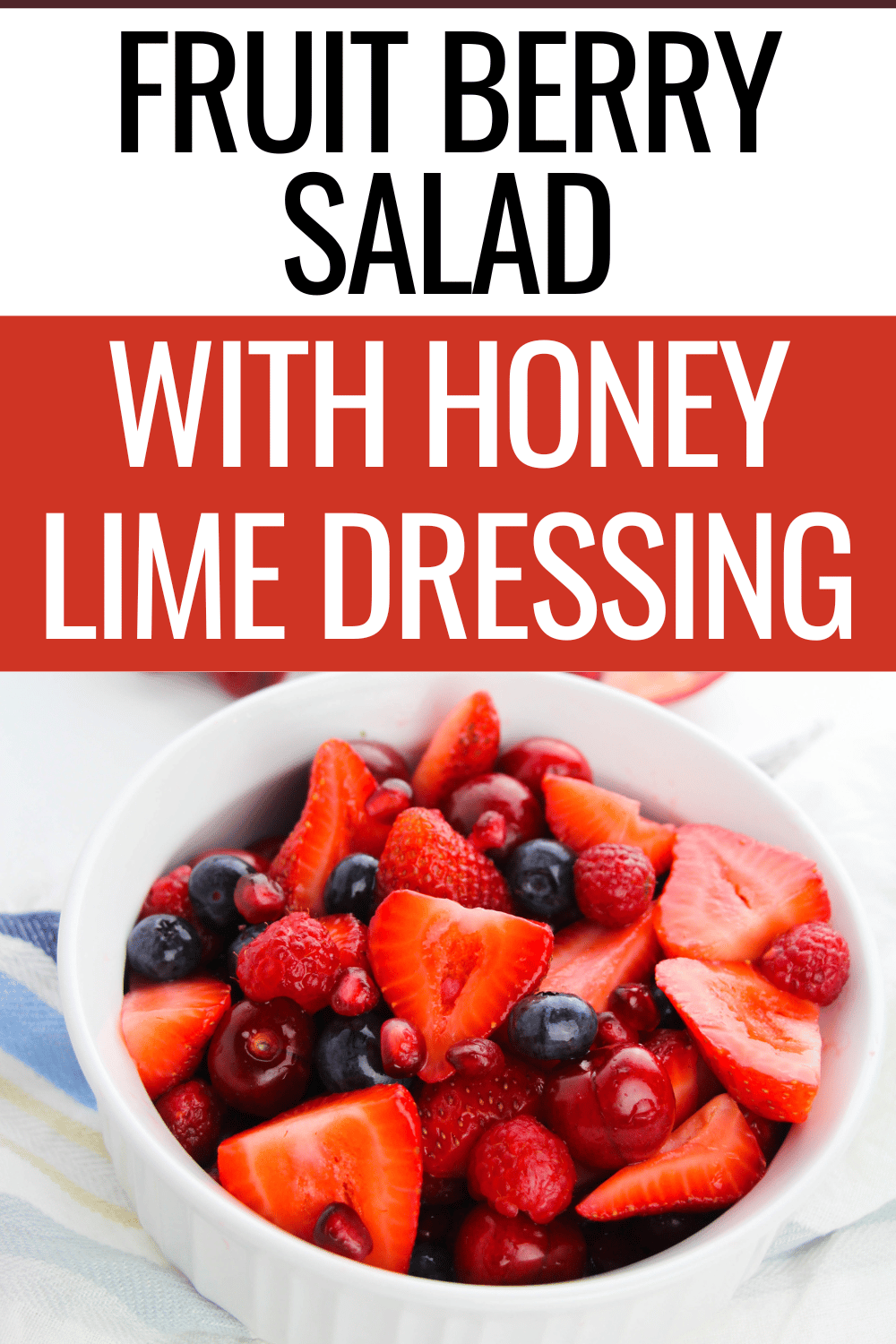fruit berry salad in a white bowl with title text reading Fruit Berry Salad With Honey Lime Dressing