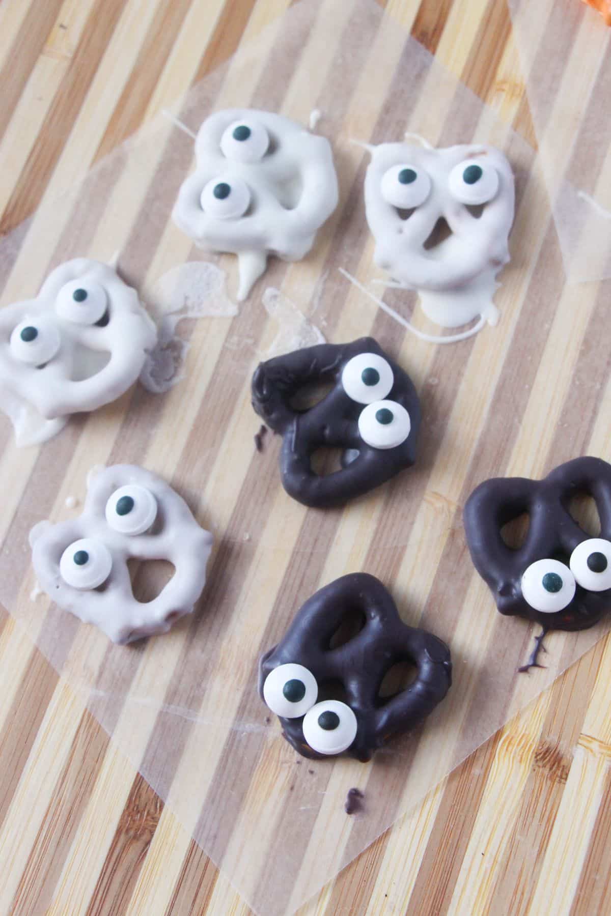 Halloween Bat and Ghost Pretzels on a baking paper