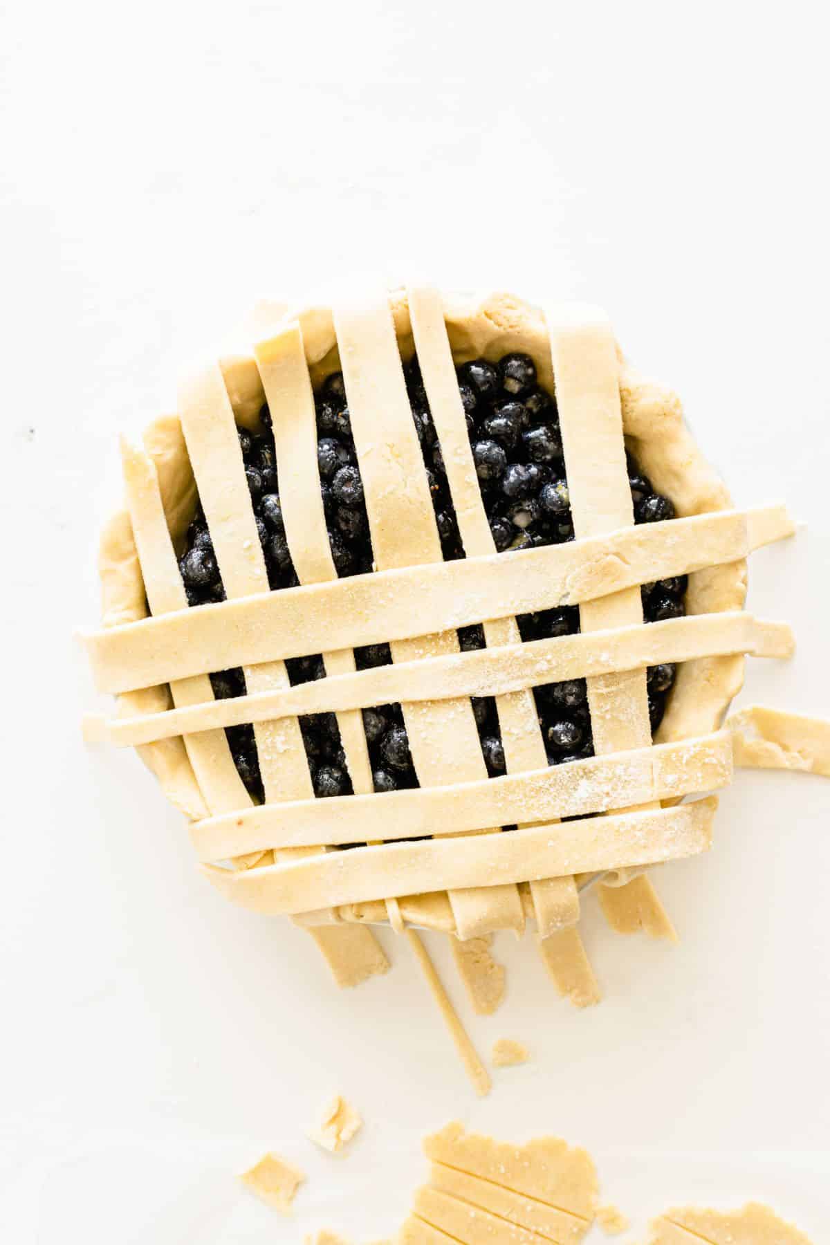 pie crust strips in a lattice pattern on the top of the pie 