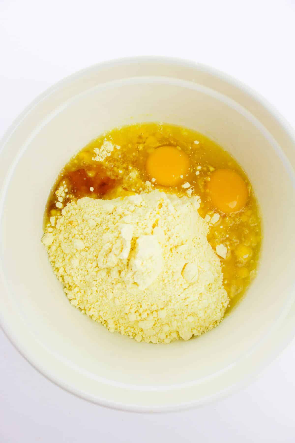 Cake mix, vegetable oil, eggs, and vanilla extract in a large bowl
