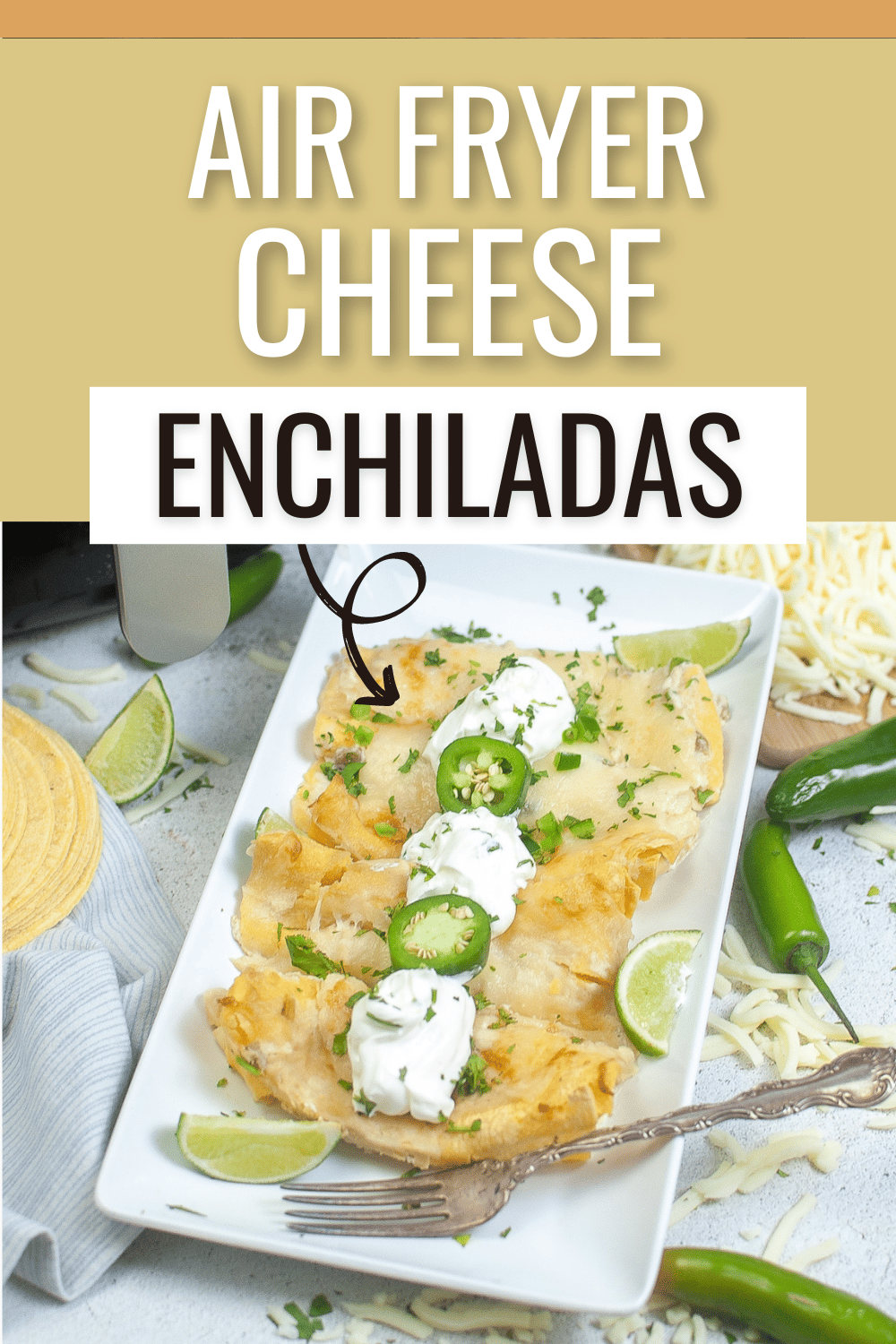 Air Fryer Cheese Enchiladas on a plate garnished with sour cream, jalapenos, green onions, and cilantro, next to a fork with shredded cheese, jalapenos and an air fryer in the background with title text reading Air Fryer Cheese Enchiladas