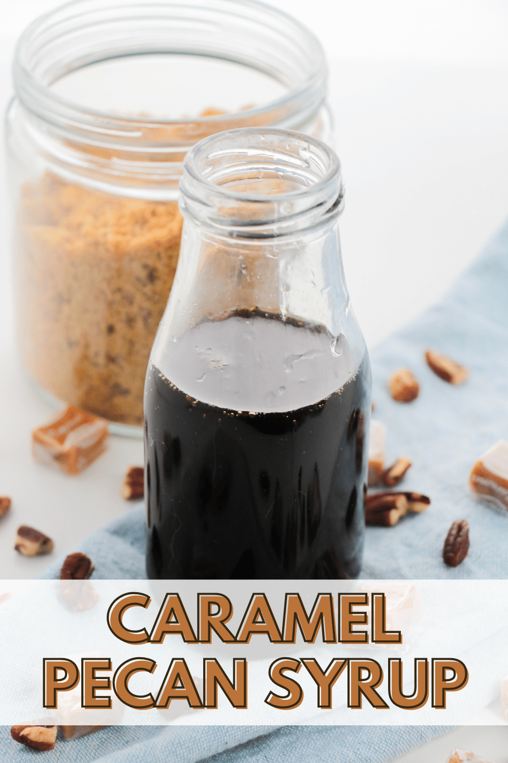 Caramel Pecan Syrup in a bottle with brown sugar and pecans on the side with title text reading Caramel Pecan Syrup
