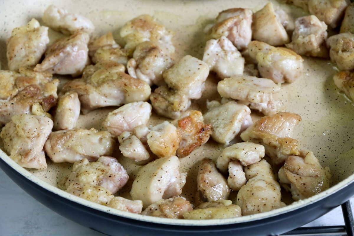 Olive oil and chicken in a large skillet