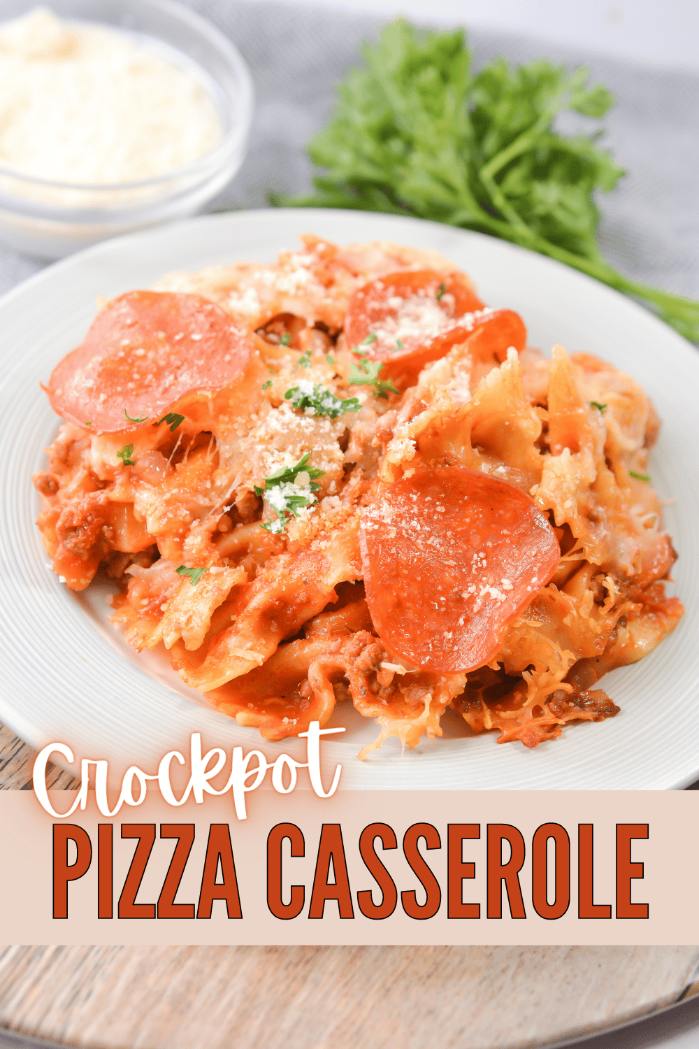 This Crockpot Pizza Casserole is an easy and delicious way to enjoy pizza for dinner! You can never go wrong with this dish. #crockpotpizzacasserole #pizzacasserole #slowcooker #recipe #pizza via @wondermomwannab