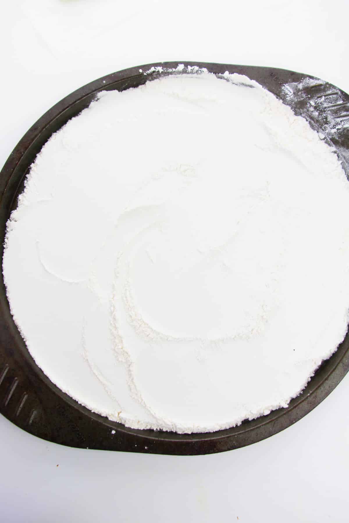 All-purpose flour on a baking sheet.