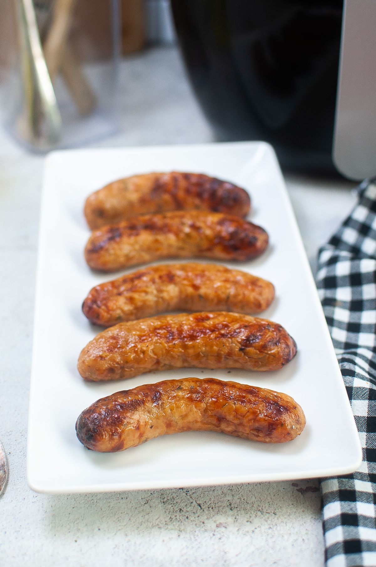 Air Fryer Sausage on a serving plate.
