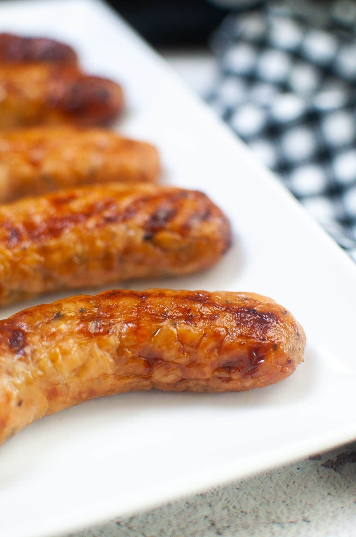 a closeup of sausage on a serving plate.