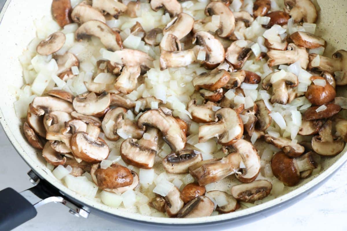 Onion, mushrooms, and garlic in a skillet.