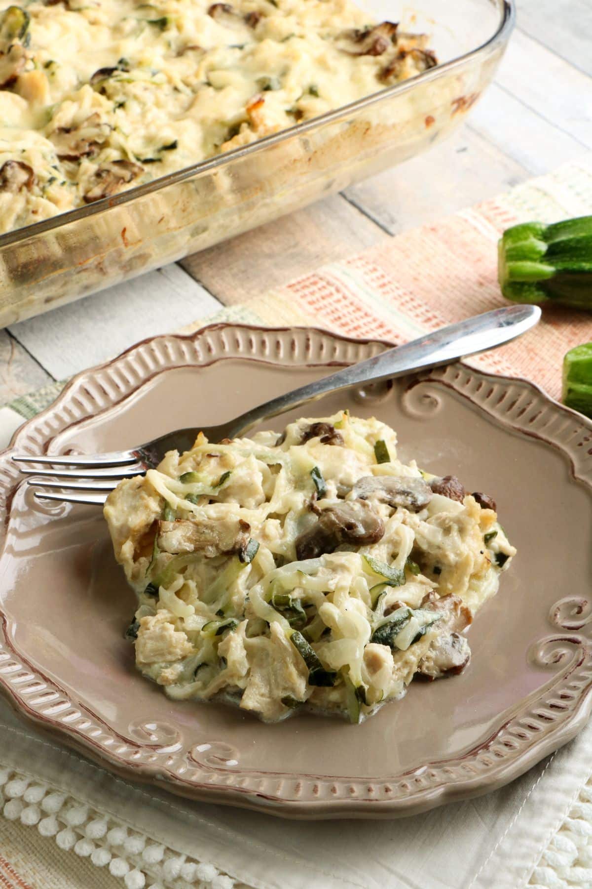 Healthy Turkey Tetrazzini on a serving plate with fork on the side.